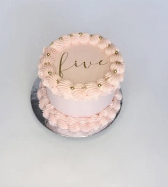 Pink vintage cake with gold 'five' lettering